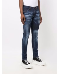 dunkelblaue enge Jeans mit Destroyed-Effekten von Philipp Plein