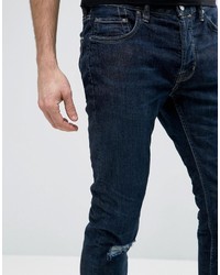 dunkelblaue enge Jeans mit Destroyed-Effekten von AllSaints