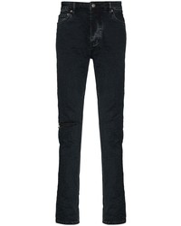 dunkelblaue enge Jeans mit Destroyed-Effekten von Ksubi