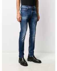 dunkelblaue enge Jeans mit Destroyed-Effekten von 7 For All Mankind