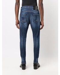 dunkelblaue enge Jeans mit Destroyed-Effekten von John Richmond