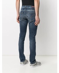 dunkelblaue enge Jeans mit Destroyed-Effekten von Dondup