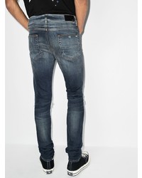 dunkelblaue enge Jeans mit Destroyed-Effekten von Amiri