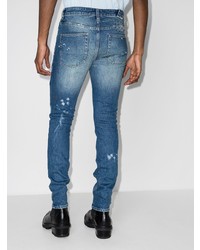 dunkelblaue enge Jeans mit Destroyed-Effekten von Ksubi