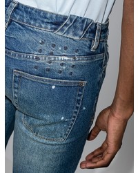 dunkelblaue enge Jeans mit Destroyed-Effekten von Ksubi