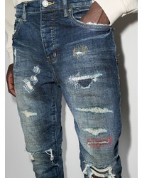 dunkelblaue enge Jeans mit Destroyed-Effekten von purple brand