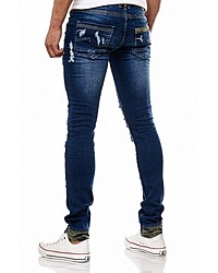 dunkelblaue enge Jeans mit Destroyed-Effekten von RUSTY NEAL