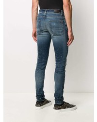 dunkelblaue enge Jeans mit Destroyed-Effekten von Amiri