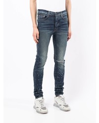 dunkelblaue enge Jeans mit Destroyed-Effekten von Amiri