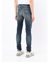 dunkelblaue enge Jeans mit Destroyed-Effekten von Amiri