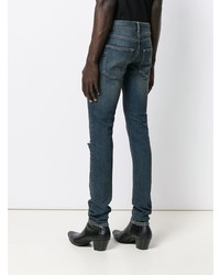 dunkelblaue enge Jeans mit Destroyed-Effekten von Saint Laurent