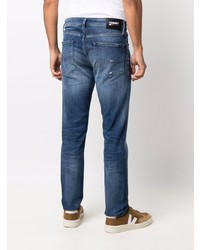 dunkelblaue enge Jeans mit Destroyed-Effekten von Tommy Jeans