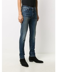 dunkelblaue enge Jeans mit Destroyed-Effekten von Amiri