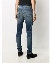 dunkelblaue enge Jeans mit Destroyed-Effekten von Amiri