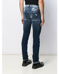 dunkelblaue enge Jeans mit Destroyed-Effekten von Philipp Plein