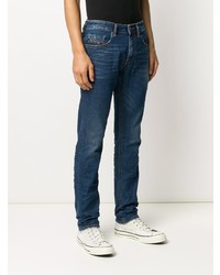 dunkelblaue enge Jeans mit Destroyed-Effekten von Diesel