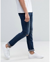 dunkelblaue enge Jeans mit Destroyed-Effekten