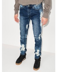 dunkelblaue enge Jeans mit Destroyed-Effekten von Ksubi