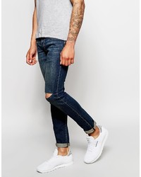 dunkelblaue enge Jeans mit Destroyed-Effekten von Izzue