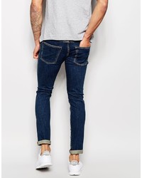 dunkelblaue enge Jeans mit Destroyed-Effekten von Izzue