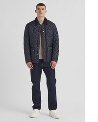 dunkelblaue Jacke mit einer Kentkragen und Knöpfen von Milestone