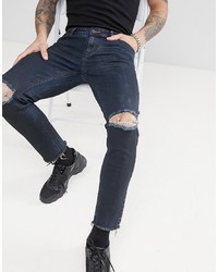 dunkelblaue Jeans mit Destroyed-Effekten von ASOS DESIGN