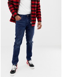 dunkelblaue Jeans mit Destroyed-Effekten von ASOS DESIGN