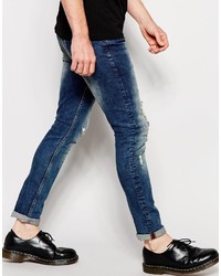 dunkelblaue Jeans mit Destroyed-Effekten von Asos