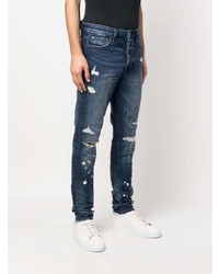 dunkelblaue Jeans mit Destroyed-Effekten von Ksubi