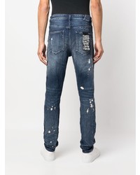 dunkelblaue Jeans mit Destroyed-Effekten von Ksubi