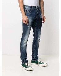 dunkelblaue Jeans mit Destroyed-Effekten von John Richmond