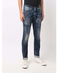 dunkelblaue Jeans mit Destroyed-Effekten von Dondup