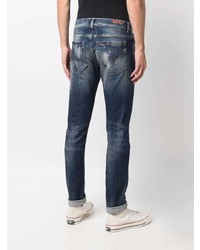 dunkelblaue Jeans mit Destroyed-Effekten von Dondup