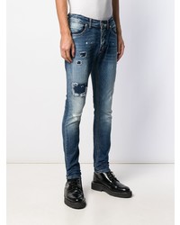 dunkelblaue Jeans mit Destroyed-Effekten von John Richmond