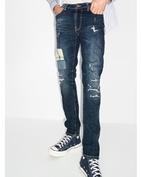 dunkelblaue Jeans mit Destroyed-Effekten von Nudie Jeans