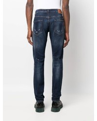 dunkelblaue Jeans mit Destroyed-Effekten von Philipp Plein