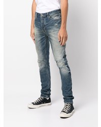 dunkelblaue Jeans mit Destroyed-Effekten von Ksubi