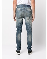 dunkelblaue Jeans mit Destroyed-Effekten von Ksubi