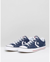 dunkelblaue Turnschuhe mit Sternenmuster von Converse