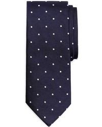dunkelblaue und weiße gepunktete Krawatte