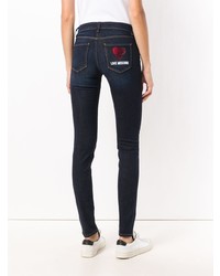 dunkelblaue verzierte enge Jeans von Love Moschino