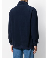 dunkelblauer Fleece-Pullover mit einem Reißverschluss am Kragen von Tommy Jeans