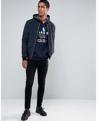 dunkelblauer Pullover mit einem Kapuze von adidas