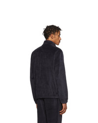 dunkelblauer Pullover mit einem Reißverschluss am Kragen von CARHARTT WORK IN PROGRESS