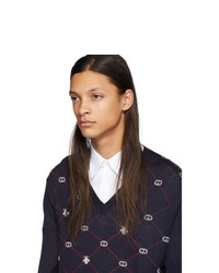 dunkelblauer Pullover mit einem V-Ausschnitt mit Argyle-Muster von Gucci