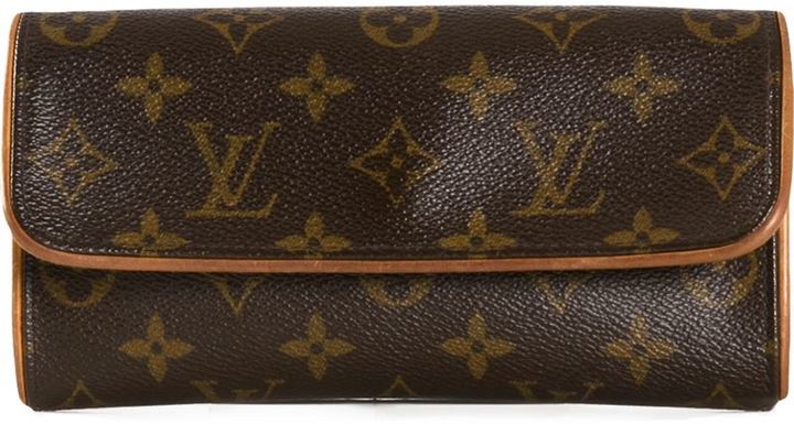 dunkelbraune bedruckte Leder Reisetasche von Louis Vuitton Vintage, €5.918, farfetch.com