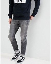 dunkelgraue enge Jeans mit Destroyed-Effekten von Calvin Klein Jeans