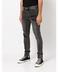 dunkelgraue enge Jeans mit Destroyed-Effekten von Ksubi