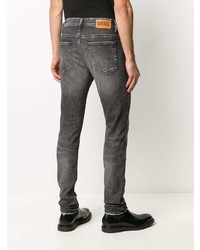 dunkelgraue enge Jeans mit Destroyed-Effekten von Diesel