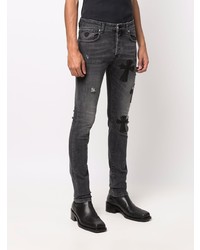 dunkelgraue enge Jeans mit Destroyed-Effekten von John Richmond